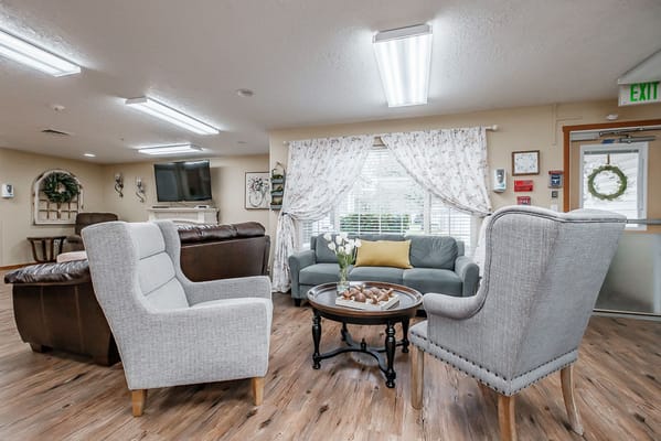 Cozy common area with armchairs and natural light