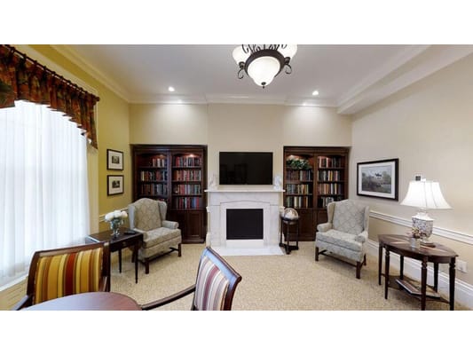 Interior common area with seating and bookshelves