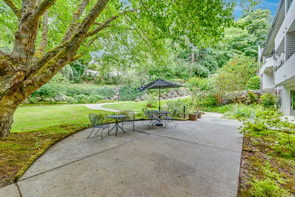 Outdoor seating area with tables and umbrellas