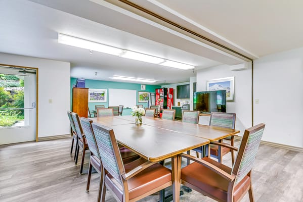 Common area with a large table and chairs