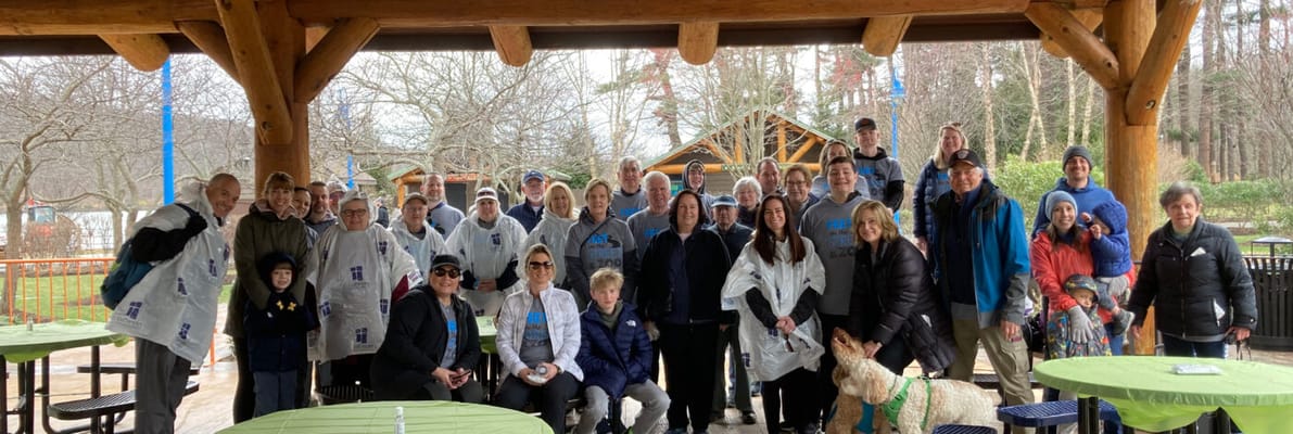 Group of residents and staff in a sheltered outdoor area