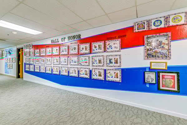 A wall displaying honor boards for veterans