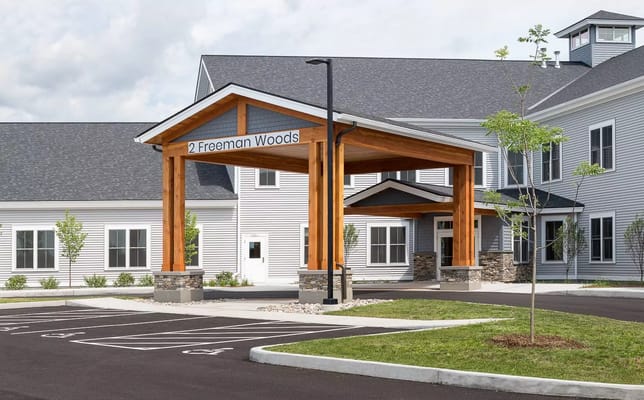 Entrance of a senior living facility with a covered awning