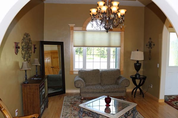 Cozy living room with chandelier and seating area