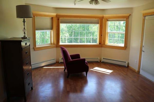 An interior view of a sunny room with windows