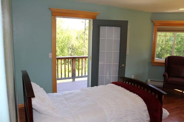 Cozy resident room with a bed and balcony view