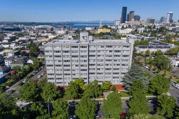Aerial view of Kawabe Memorial House building with city skyline