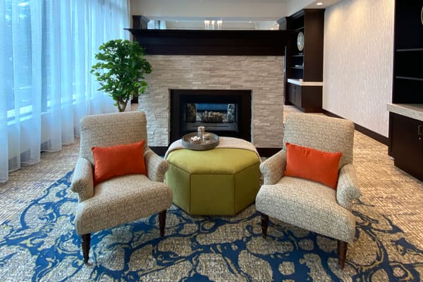 Cozy seating area with a fireplace in a common space
