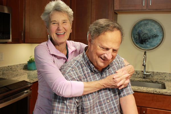 Residents enjoying time together in the kitchen