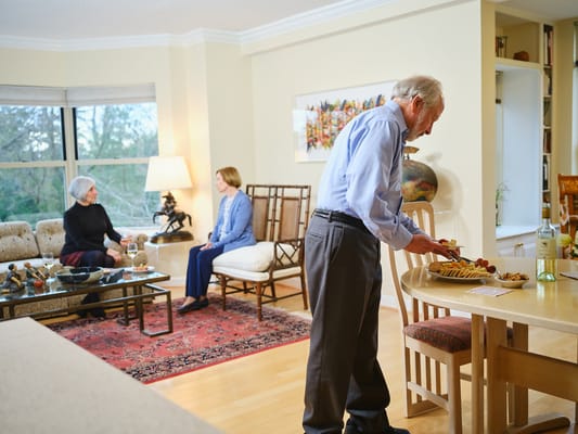 Residents socializing in a bright living area