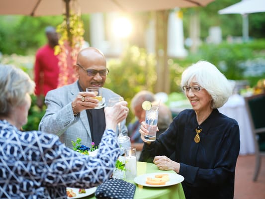 Residents enjoying drinks at an outdoor gathering