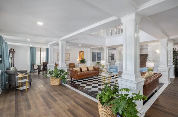 Spacious common area with comfortable seating and plants