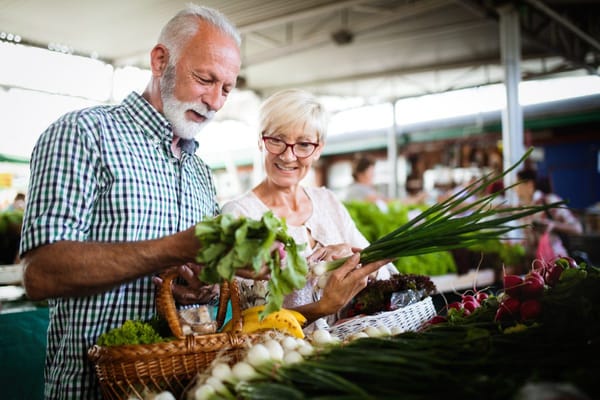 Residents enjoying fresh produce at a market