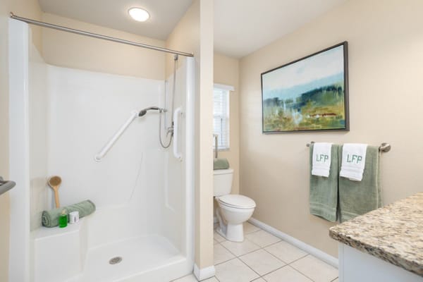 Bright and clean bathroom with safety features
