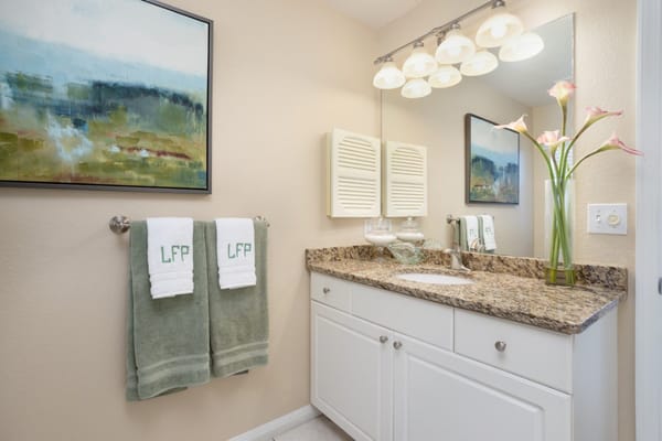 Elegant bathroom with towels and decor