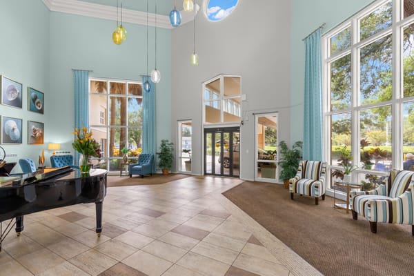 Interior lobby with piano and seating area