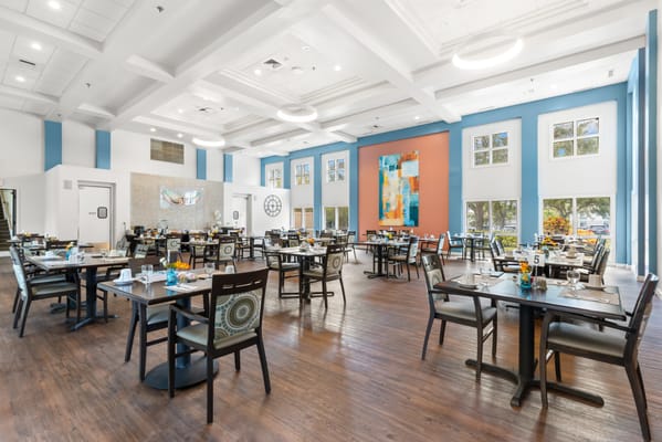 Dining area set up for a meal with colorful table settings