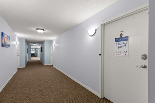 Residential hallway with decorated door