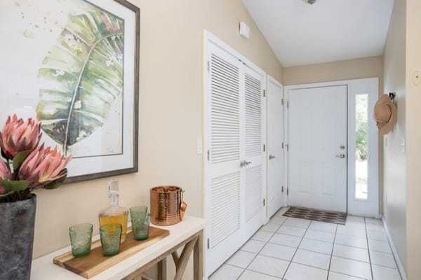 Bright entrance hallway with decor and plants