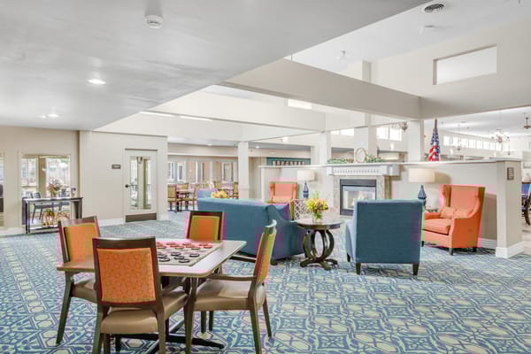 Bright and welcoming common area with seating and activity table