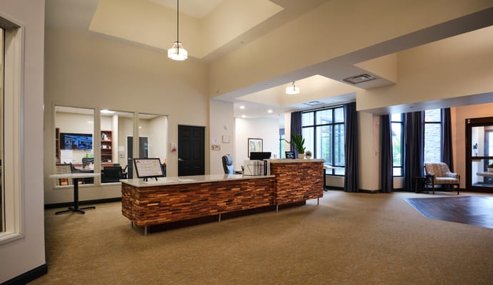Bright lobby area with reception desk and seating