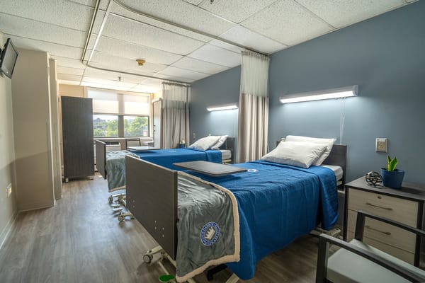 Cozy shared room with twin beds and natural light