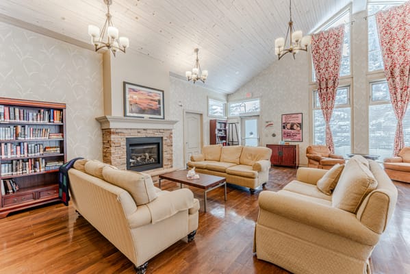 Common area with comfortable seating and bookshelves