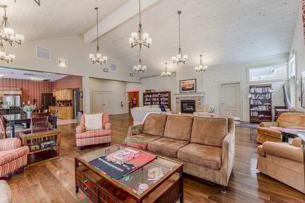 Bright common area with seating and bookshelves
