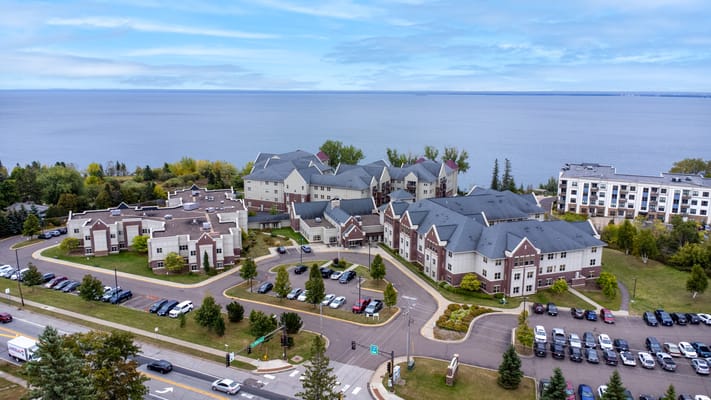 Aerial view of a senior living facility by the lake