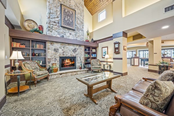 Cozy interior common area with stone fireplace