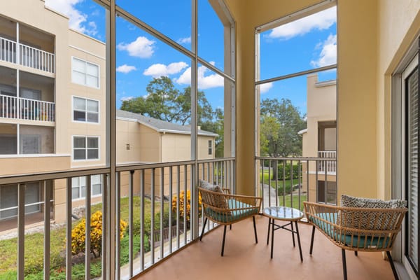 Bright interior balcony with seating and outdoor view