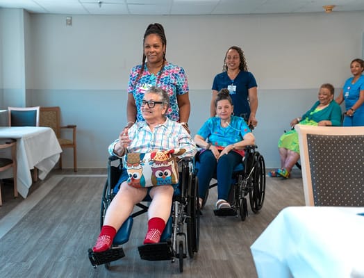 Residents participating in an activity with staff support