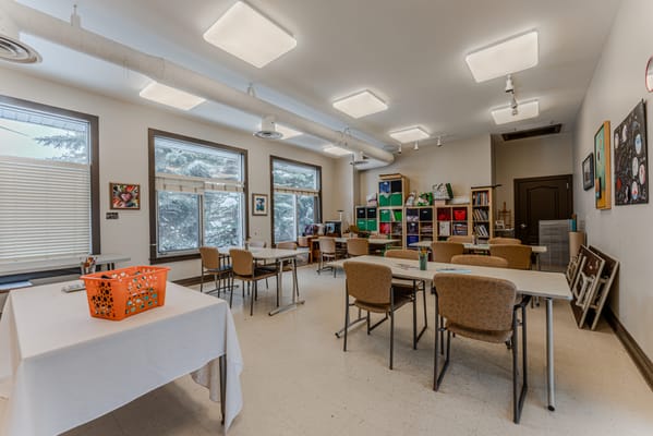 Bright, spacious activity room set up for art projects