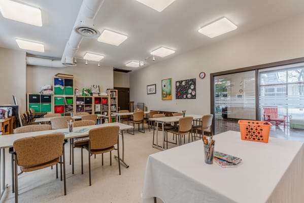 Art activity room with tables and supplies