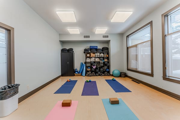 Yoga mats set up in a calm activity room