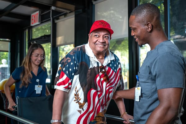 Residents interacting with staff in a common area