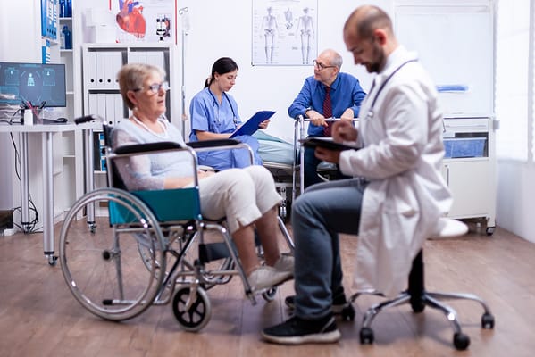 Healthcare staff attending to residents in a clinic