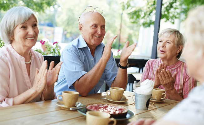 Residents enjoying time together outdoors with refreshments
