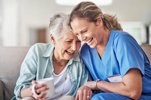 Staff and resident sharing a joyful moment together