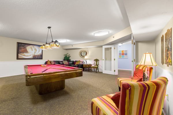 Interior lounge area with a pool table and seating