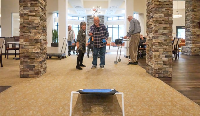 Residents engaged in an activity in a cozy common area