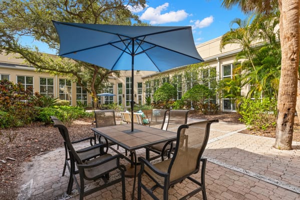 Outdoor seating area with tables and umbrellas
