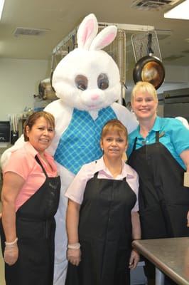Staff and a costumed bunny in the kitchen