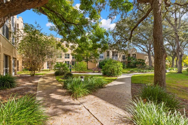 Landscape view of a garden pathway in a senior living facility