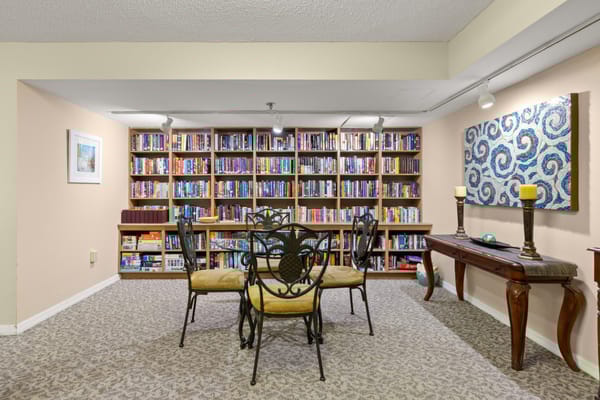 Cozy common area with bookshelves and seating