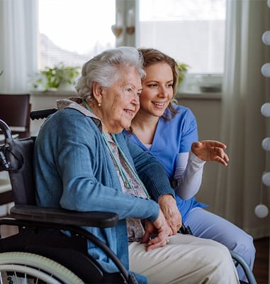 Resident and staff member sharing a joyful moment