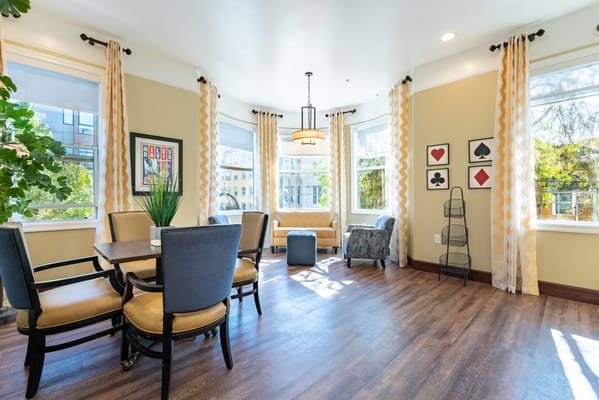 Bright common area with seating and natural light