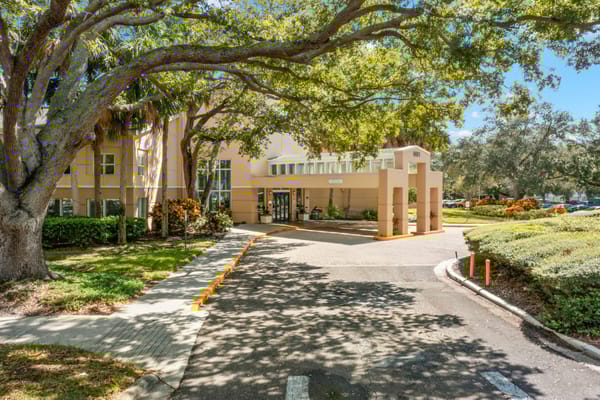 Exterior view of The Barrington entrance with landscaping