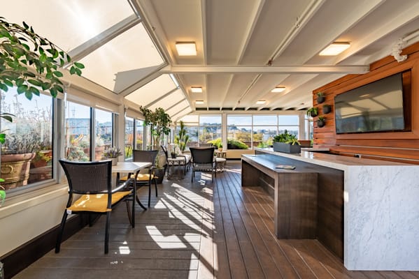 Bright common area with seating and plants