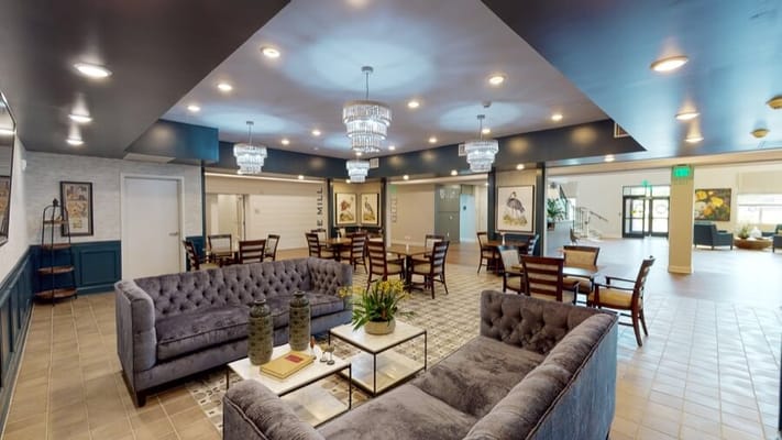 Modern common area with seating and decorative lighting